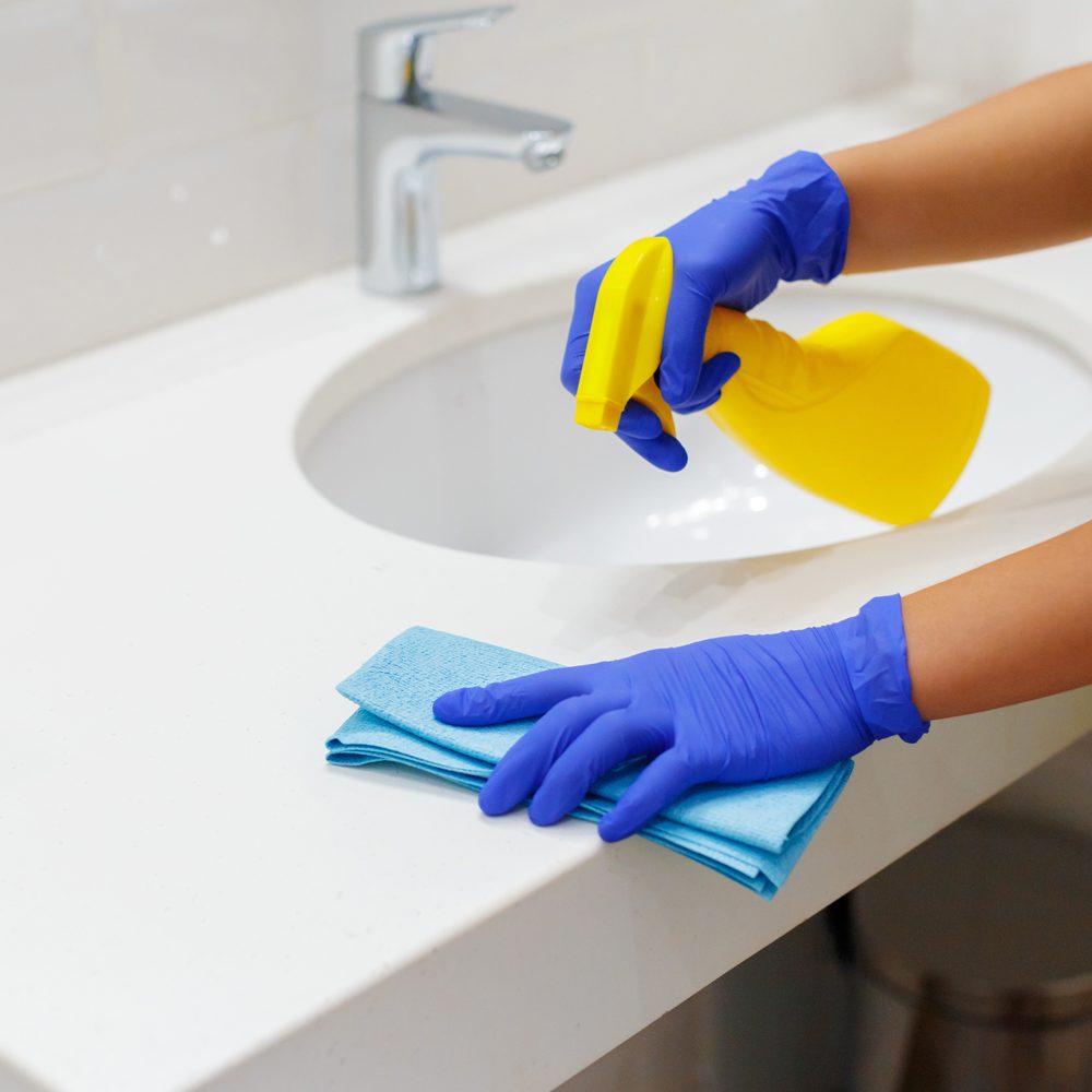 Housekeeper cleaning a hotel room